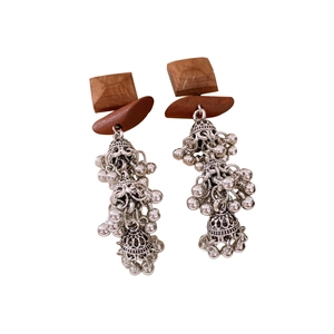 Ethnic vintage earrings with wooden squares and silver metal tassel charms on white back