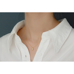 Elegant S925 silver gold necklace featuring a rectangular zircon pendant on a model