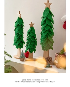 Three green felt Christmas tree desk ornaments in different sizes with wooden bases