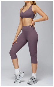 Deep V-neck sports bra and high-waisted cropped yoga leggings set in purple