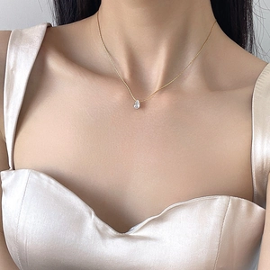 Elegant 18K gold plated titanium necklace with pear-shaped water drop pendant on model