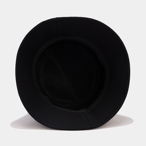 Detail view showing interior stitching and twill cotton lining of the black bucket hat