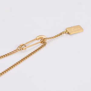 Minimalist 18k gold paperclip chain necklace with a square Love pendant tag
