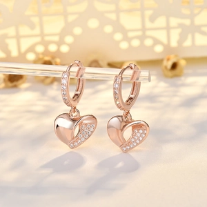 Elegant rose gold 3D heart-shaped earrings with sparkling micro-pave crystals
