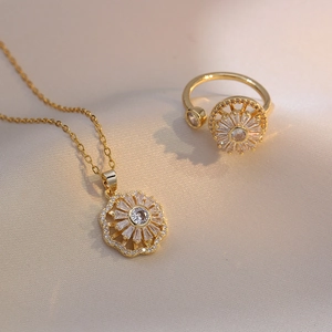 Detailed view of sunflower jewelry set featuring gold finish and sparkling zircon stones