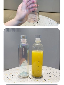 Detail of time markers and refill goals on iridescent glass water bottle surface