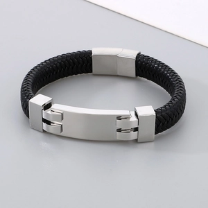 Macro view of black braided leather texture and polished stainless steel magnetic clasp
