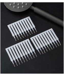 Detail view of mini cleaning brushes for unclogging shower head nozzles and phone holes