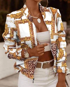 Detail of baroque jacket with gold chain print, leopard patterns and metal zipper