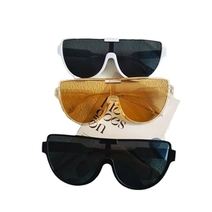Three pairs of oversized rimless semi-round sunglasses in white, yellow, and black colors