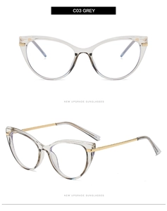 Detail view of transparent grey cat-eye glasses frame with thin gold metal temples