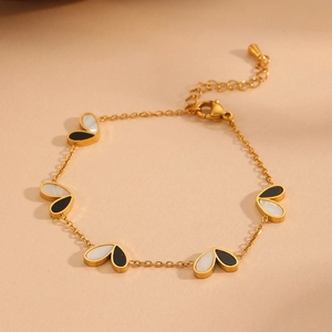 Elegant gold titanium steel bracelet with black and white enamel butterfly pendants