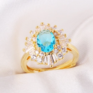 Detailed macro shot of adjustable ring with blue oval crystal and flower zircon petals