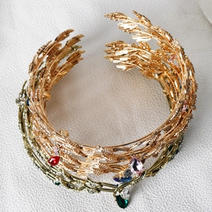 Detail view of golden leaf bridal tiara with colorful crystal waterdrop pendants