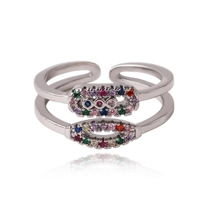 Detail of silver double-layered ring with multi-color zircon stones in a wave pattern