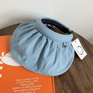 Stylish sky blue shell-shaped sun visor hat for outdoor UV protection and summer fashion.