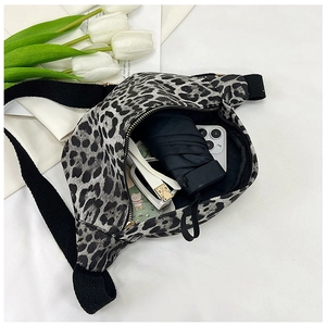 Detailed top view of the spacious inner pocket of this leopard print crossbody waist bag