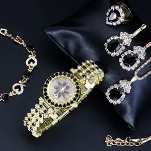 Detailed view of women's watch set featuring black stones and sparkling crystals