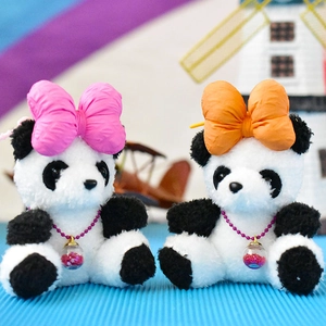Cute plush panda keychain with large pink and orange bows and glitter ball pendant.