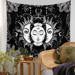 Artistic detail of Bohemian moon and sun tapestry hanging in a cozy living room setup