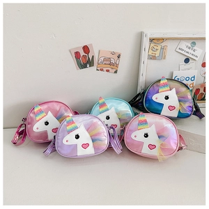 Detail view of colorful unicorn crossbody bags for girls in five shiny pastel shades