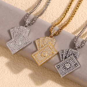Detailed view of playing card pendants in gold, silver, and black with sparkling crystals