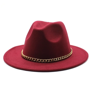 Close-up of a burgundy wool fedora hat featuring a stylish gold chunky metal chain link