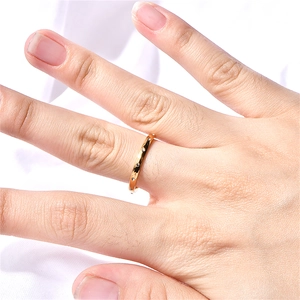 Minimalist 18k gold plated stainless steel ring with black zircons on woman's finger