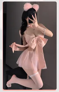 Detail of pink cat cosplay outfit with large bow, mesh skirt, and plush cat ears