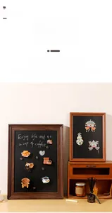 Macro detail of magnetic wood frame with black galvanized plate for badges and photos