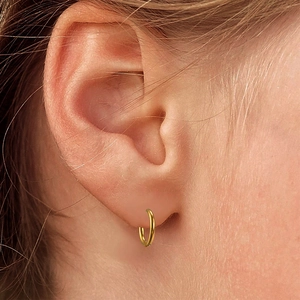 Minimalist gold huggie hoop earrings in titanium steel for a sleek aesthetic look