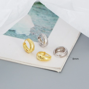 Detailed close-up of 8mm S925 sterling silver hoop earrings with inner metal hallmark