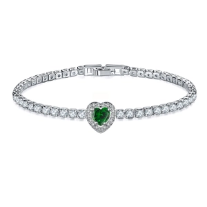 Detail shot of heart-shaped green emerald tennis bracelet with sparkling zircon stones