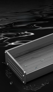 Close-up of dark gray kitchen rack with parallel drainage slots and waterproof metal texture