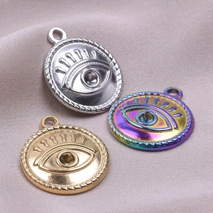 Detailed view of evil eye charms in gold, silver and rainbow finish for DIY jewelry