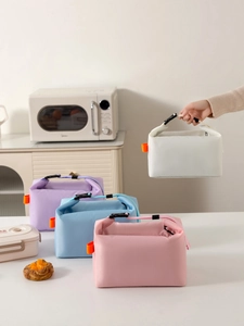 Close-up of four colorful insulated lunch bags with hand-held buckle and thermal foil lining