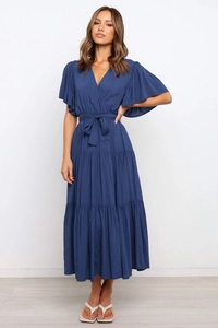 Navy blue V-neck wrap dress with ruffle sleeves and tiered skirt featuring waist tie