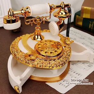Macro detail of retro telephone music box with golden accents and jewelry drawer
