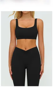 Front view of black sports bra with square neck and high-waist V-cross yoga leggings