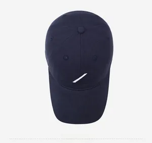 Top view of dark blue cotton baseball cap with white diagonal stripes embroidery detail