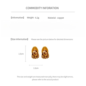 Detail view of leopard print copper hoop earrings showing 1.6cm x 1.5cm product dimensions