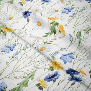 Detail shot of boho floral tapestry fabric with watercolor daisies and wildflowers