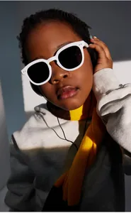 Close-up of trendy white frame kids polarized sunglasses with dark round lenses