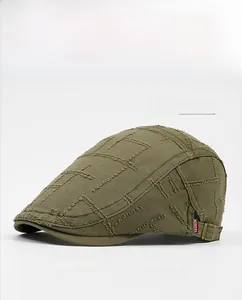 Detail showing army green vintage distressed cotton cap with side red fashion label