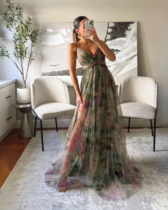 Detail of artistic mesh maxi dress featuring deep V-neck and colorful watercolor print
