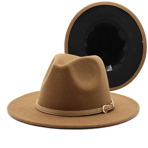 Detail view of a two-tone wool fedora hat with leather strap and inner lining details
