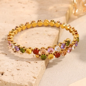 Detailed close-up of 18K gold-plated stainless steel bracelet with colorful round zircons