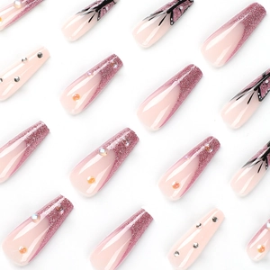 Pink glitter coffin nails with butterfly patterns and rhinestone accents in aurora finish
