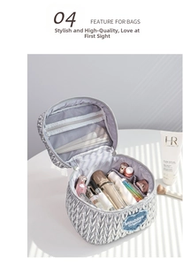 Detail view of silver quilted makeup bag featuring interior brush slots and mesh pocket