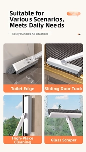 Detail of 2-in-1 floor brush showing rotating head for gaps and squeegee function